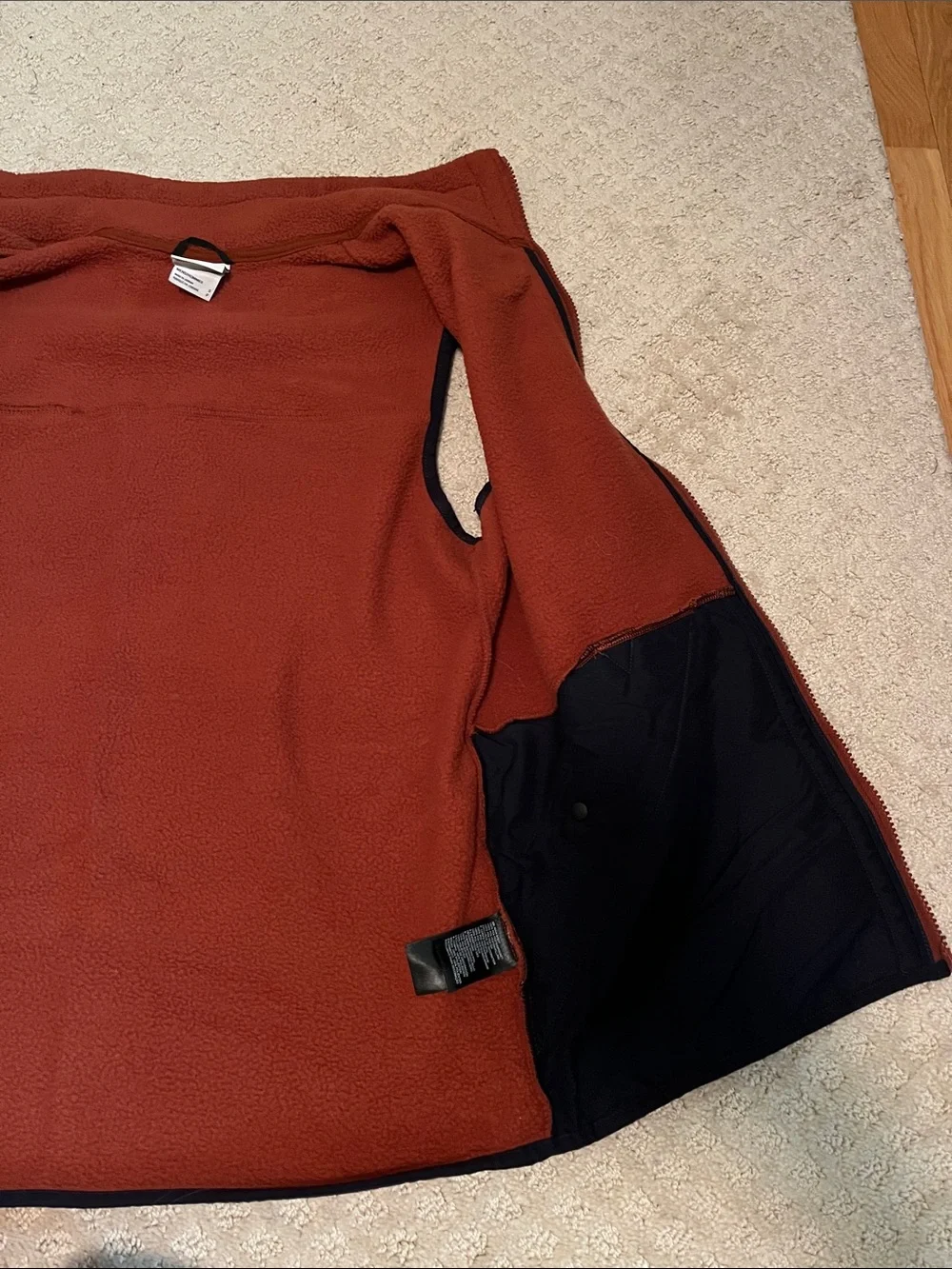 The North Face: Men's Burnt Orange Fleece Vest with Contrast Trim